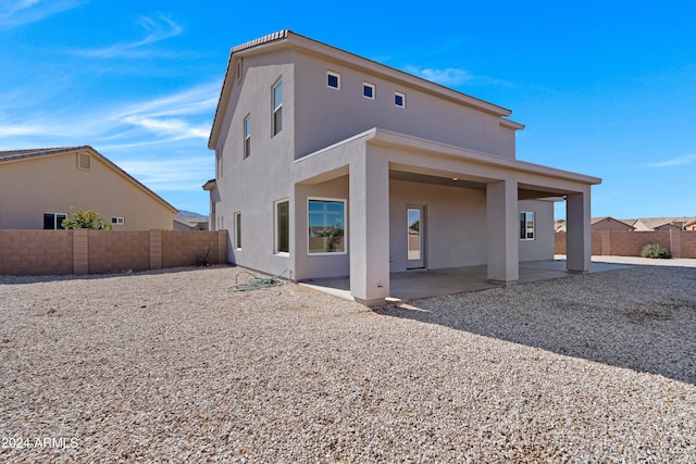 back of property featuring a patio area