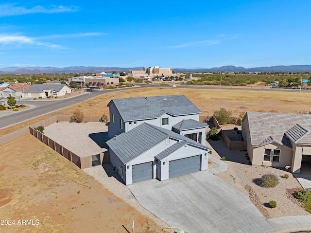 birds eye view of property with a mountain view