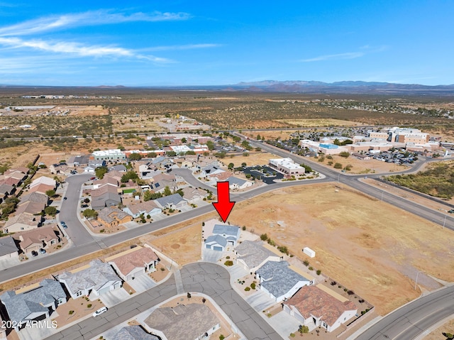 birds eye view of property featuring a mountain view