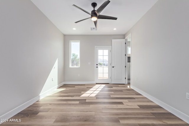 entryway with light hardwood / wood-style flooring and ceiling fan