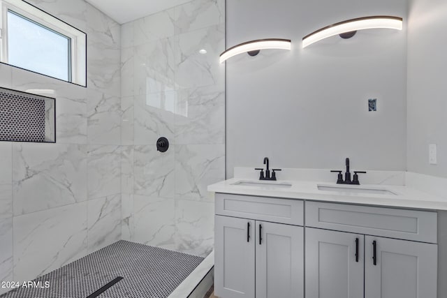 bathroom featuring vanity and a tile shower