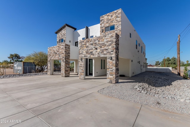 rear view of house with a patio