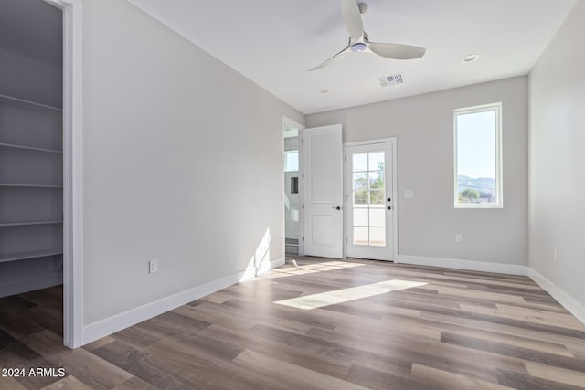 interior space with hardwood / wood-style flooring and ceiling fan