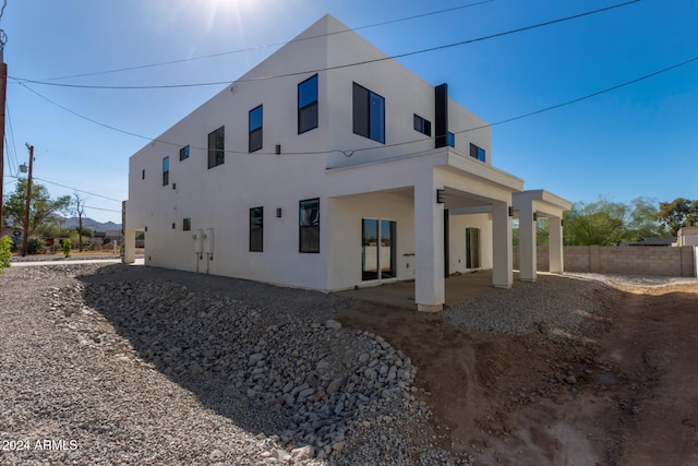 back of property featuring a patio