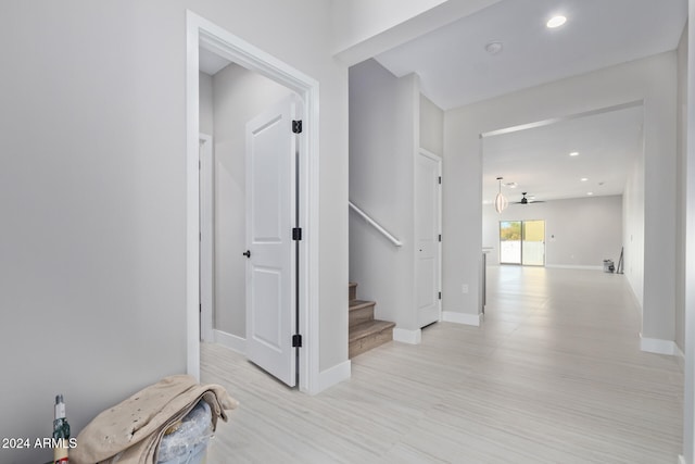 hall with light hardwood / wood-style flooring