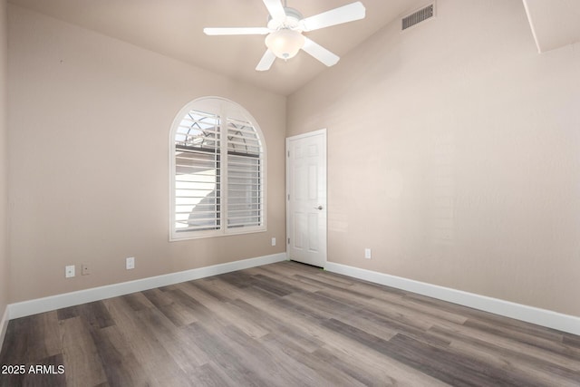 unfurnished room featuring a ceiling fan, baseboards, visible vents, and wood finished floors