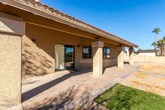 view of patio / terrace featuring fence