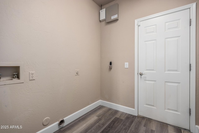 washroom with hookup for a washing machine, laundry area, baseboards, dark wood finished floors, and electric dryer hookup