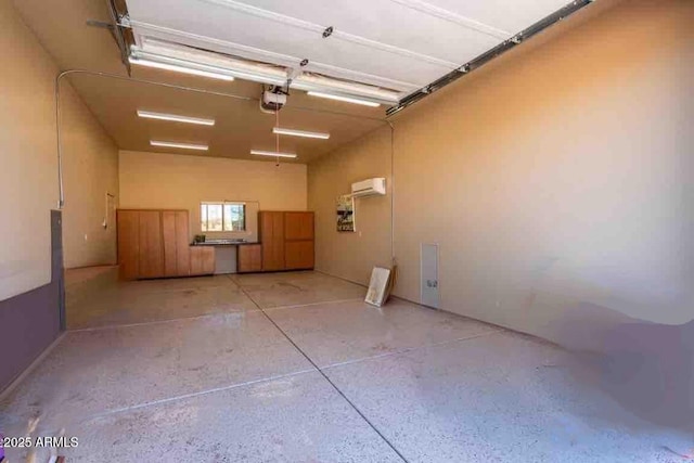 garage with an AC wall unit and a garage door opener