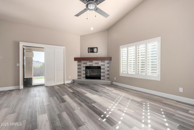 unfurnished living room featuring light wood-style floors, a fireplace, and baseboards