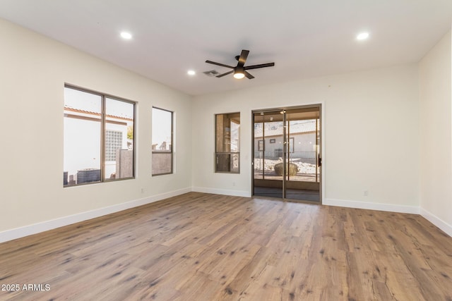 unfurnished room featuring ceiling fan and light hardwood / wood-style floors