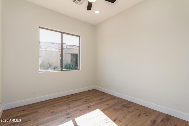 unfurnished room with ceiling fan and wood-type flooring