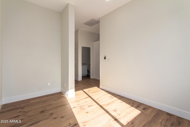 unfurnished room featuring hardwood / wood-style floors