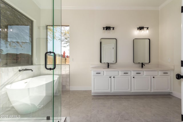 bathroom with vanity, a tub to relax in, tile patterned floors, and crown molding