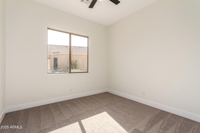 carpeted empty room featuring ceiling fan