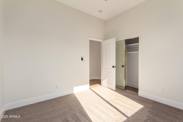 unfurnished bedroom featuring a closet and carpet floors