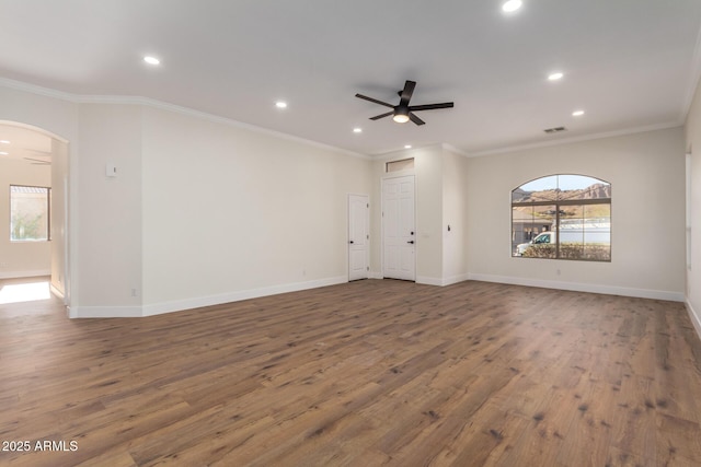 unfurnished room with hardwood / wood-style flooring, ceiling fan, and ornamental molding