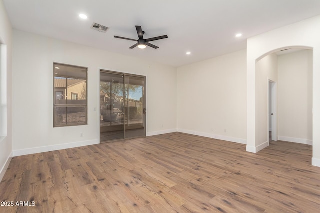 empty room with ceiling fan and wood-type flooring