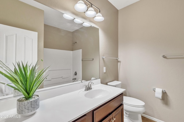7580 W Darrel Rd, Laveen, AZ 85339 - bathroom featuring toilet, vanity, baseboards, and shower / washtub combination