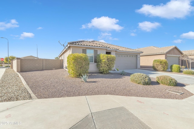 7580 W Darrel Rd, Laveen, AZ 85339 - view of front of home featuring stucco siding, a garage, a tiled roof, and driveway