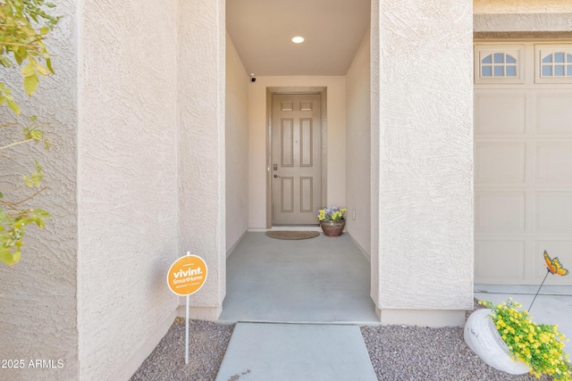 7580 W Darrel Rd, Laveen, AZ 85339 - view of exterior entry with stucco siding and a garage