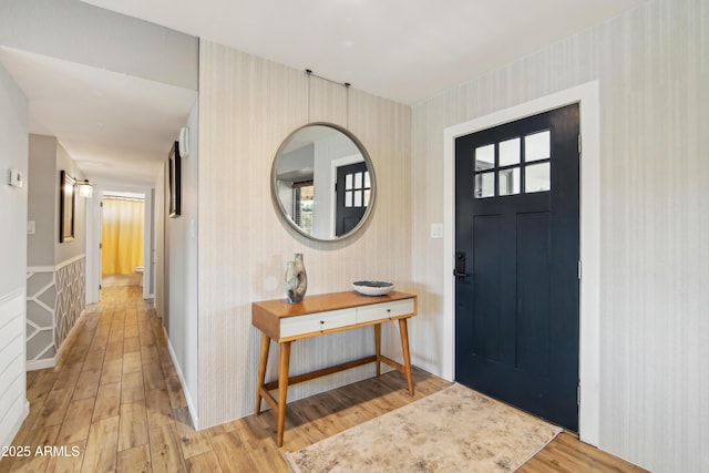 8730 E Montecito Ave, Scottsdale, AZ 85251 - entrance foyer featuring light wood finished floors and wallpapered walls