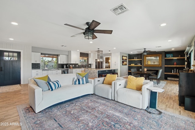 8730 E Montecito Ave, Scottsdale, AZ 85251 - living area featuring recessed lighting, a ceiling fan, light wood finished floors, and visible vents