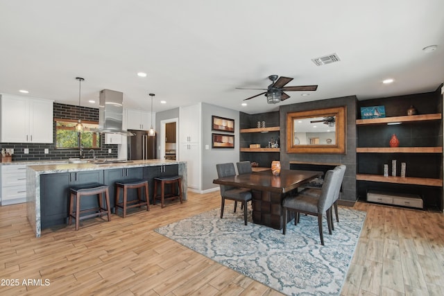8730 E Montecito Ave, Scottsdale, AZ 85251 - dining area featuring a ceiling fan, visible vents, recessed lighting, and light wood-style floors