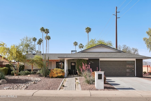 8730 E Montecito Ave, Scottsdale, AZ 85251 - single story home featuring a garage, driveway, and a shingled roof