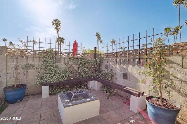 8730 E Montecito Ave, Scottsdale, AZ 85251 - view of patio featuring a fenced backyard and an outdoor fire pit