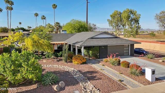 8730 E Montecito Ave, Scottsdale, AZ 85251 - ranch-style house with roof with shingles, a mountain view, and concrete driveway
