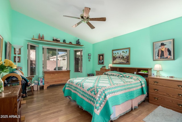 bedroom featuring wood-type flooring, lofted ceiling, access to outside, and ceiling fan