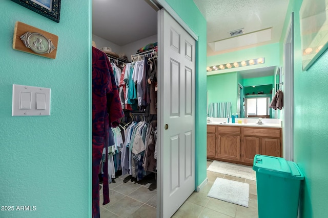 bathroom with vanity and tile patterned floors