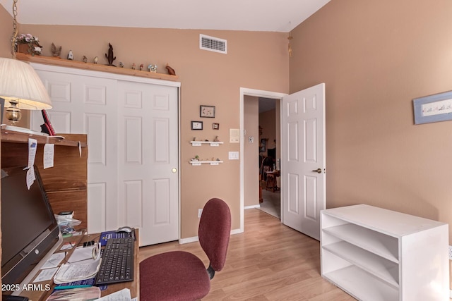 office with light hardwood / wood-style floors