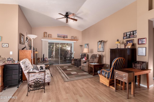 sitting room featuring ceiling fan, lofted ceiling, and light hardwood / wood-style flooring