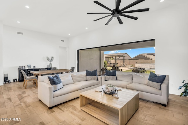 20716 E Pummelos Rd, Queen Creek, AZ 85142 - living area featuring a ceiling fan, light wood-style floors, and recessed lighting