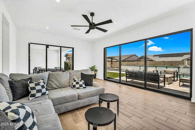 20716 E Pummelos Rd, Queen Creek, AZ 85142 - living room with a ceiling fan, recessed lighting, and wood finished floors