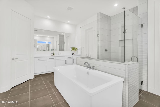 20716 E Pummelos Rd, Queen Creek, AZ 85142 - full bath featuring tile patterned flooring, a shower stall, a freestanding bath, recessed lighting, and vanity