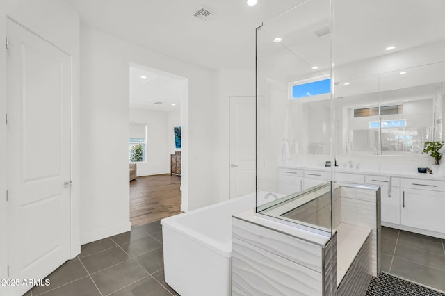 20716 E Pummelos Rd, Queen Creek, AZ 85142 - bathroom with vanity, ensuite bath, tile patterned floors, a freestanding tub, and recessed lighting