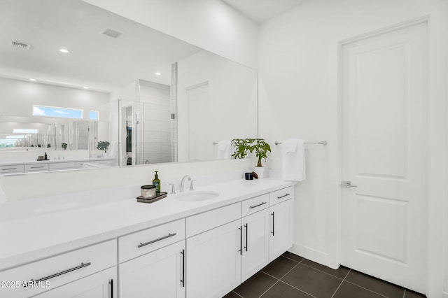 20716 E Pummelos Rd, Queen Creek, AZ 85142 - full bath with vanity, tile patterned flooring, a tile shower, and recessed lighting
