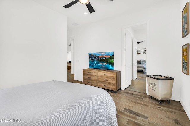 20716 E Pummelos Rd, Queen Creek, AZ 85142 - bedroom with wood finished floors, a ceiling fan, and recessed lighting