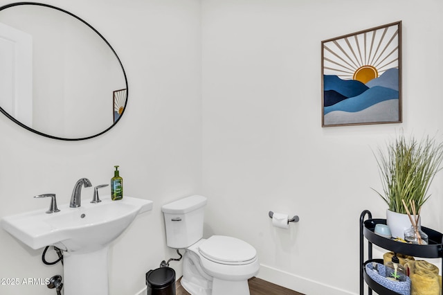 20716 E Pummelos Rd, Queen Creek, AZ 85142 - half bathroom with baseboards and wood finished floors