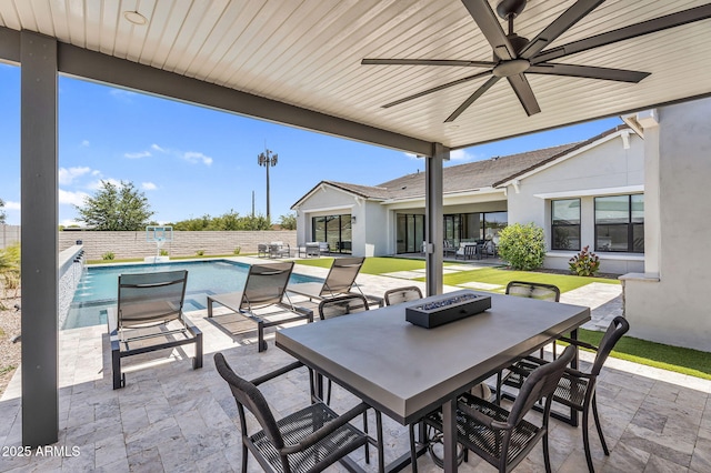20716 E Pummelos Rd, Queen Creek, AZ 85142 - fenced backyard with outdoor dining space, a patio area, ceiling fan, and a fire pit