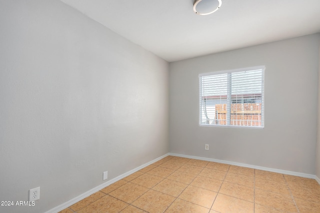 empty room featuring light tile patterned flooring