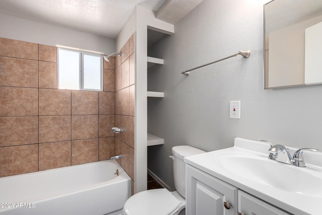 full bathroom featuring vanity, a textured ceiling, tiled shower / bath combo, built in shelves, and toilet