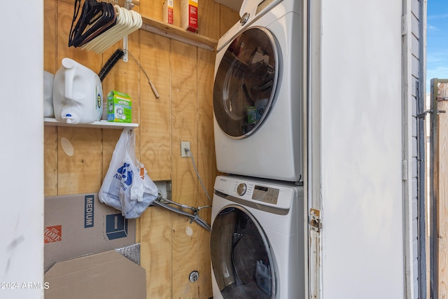 washroom with stacked washer and clothes dryer