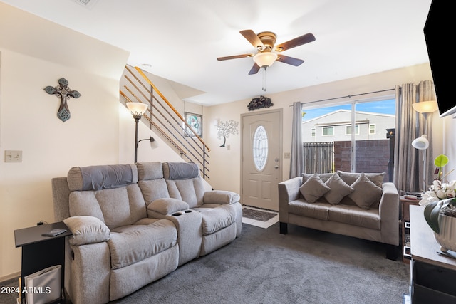 living room with dark colored carpet and ceiling fan