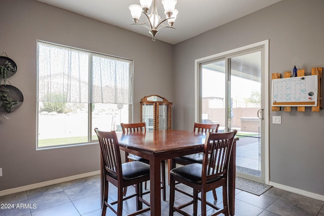 tiled dining area with a notable chandelier