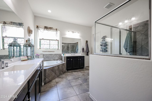 bathroom with vanity, shower with separate bathtub, and tile patterned floors