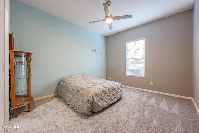 bedroom with light carpet and ceiling fan